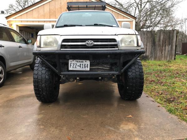 Stance with 35s, Also front bumper. Zoom in and look at my c channel protecting my radiator. Had the entire front end sitting on that on a rock and sa