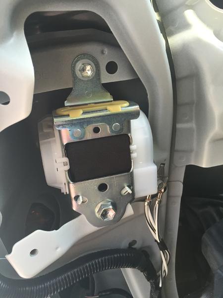 Step 13:  Remove the lower and then upper bolts of the belt retraction unit and then remove the unit and the belt.