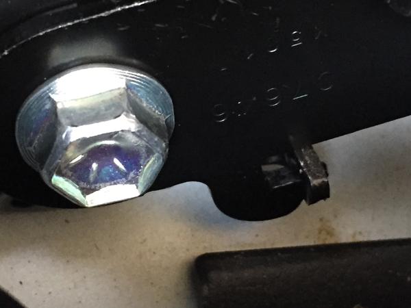 Step 16:  Install the lower belt support making sure the hook is under the protrusion.