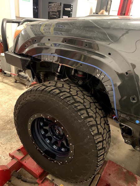 Still needed more room to help clear the 35's. Cut the fender and flare roughly 1.5" and bolted the flare on