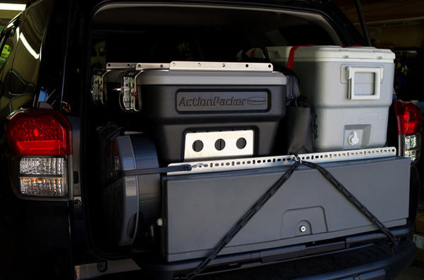 Storage drawer is bolted to OEM sliding cargo deck and can slide out