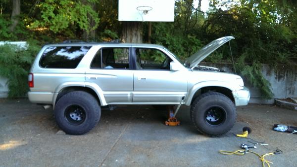 Summer 2014 - jokingly test fitting 35"*12.5"R15's on a stock height 3rd gen… pawl.