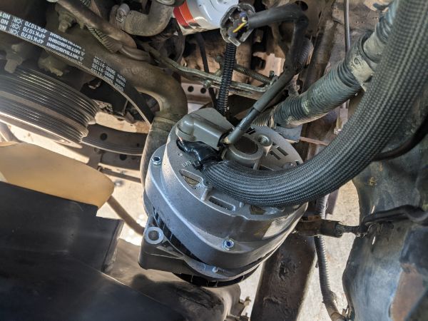 Sweet shot of the back of the alternator. I was able to use the "bend and drill" technique in Doc's CS144 thread to reuse the stock connector and plas