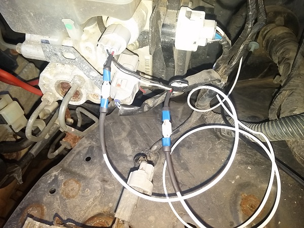 Tapped into the red wire on the sensor with spade connectors then used heat shrink to help keep it clean. Wrapped it all in weather resistant electric