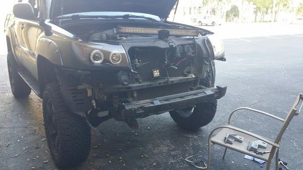 Tearing her down to put the new bumper on.