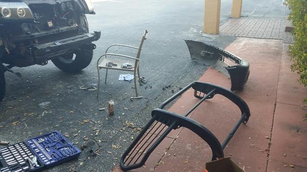 Tearing her down to put the new bumper on.