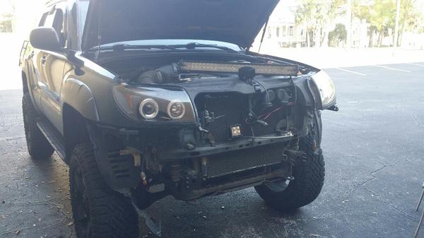 Tearing her down to put the new bumper on.
