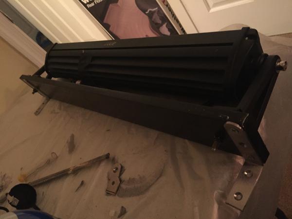 The aluminum base, coated in truck bed liner, with the L-brackets on the back.