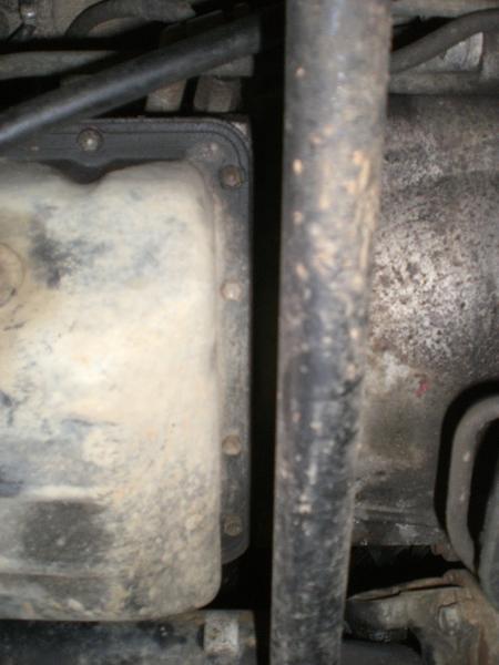The bolts forward of the pan and aft of the engine. No need to remove the sway bar.