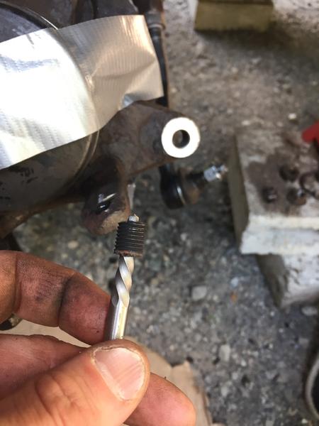 The broken bolt from the lower ball joint that was stuck in the knuckle. Many days of frustration, all for this little piece of shit.
