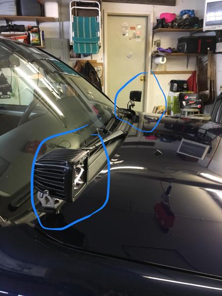 The light PODS are mounted on the hood on each side.