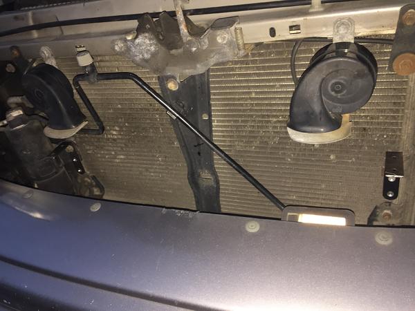 The metal L-brackets cut to accept the light bar.  The mounting position on the passenger side is about half an inch lower that the driver side.  You'