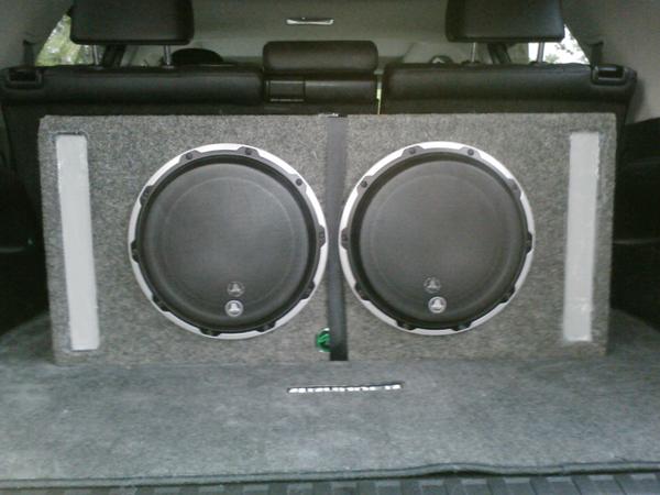 This is a "Brand New" sub that I purchased a couple of months ago. The cab is made by "Audio Enhancers" and is a driver specific enclosure; not a gene