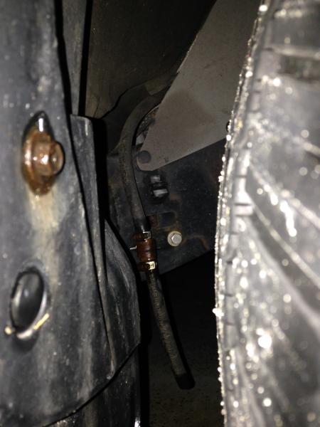 This is my relocated A/C drain hose. Brought it from engine compartment where it drained right on top of frame to rear of pass side front wheel well w