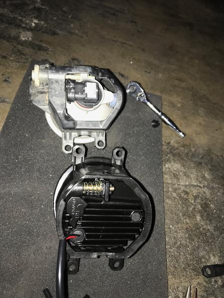 To remedy the large gap between the Morimoto fog light lens and the housing that it sits in, I decided to swap out the mounts. Top is OEM and bottom i