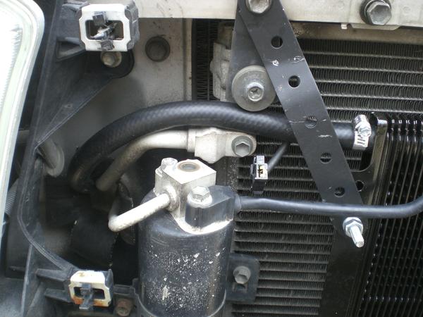 Top hose goes back to the transmission.