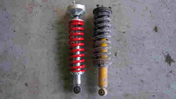 Toyotec front coilovers vs Old Man Emu - I like that the spring sits in a cup thats below the pivot point.