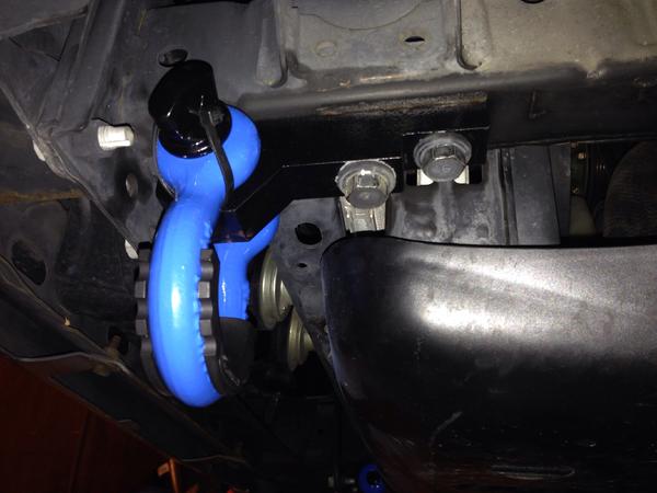 trackdecal.com shackle brackets. 3/4" D-Rings, Daystar Isolators, 11" zip ties and a little sky blue rattle-can paint.