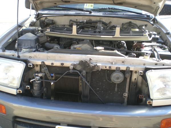 Tranny cooler mod and the grille resting on top of my squirrel cage of a four-banger.