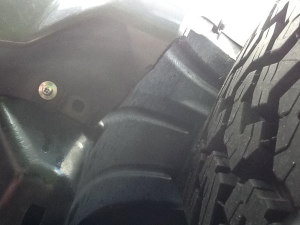 Trimmed fender, relocated front inner fender to clear 265/70R17s