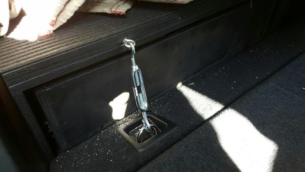 Turnbuckle for drawer hold-down.