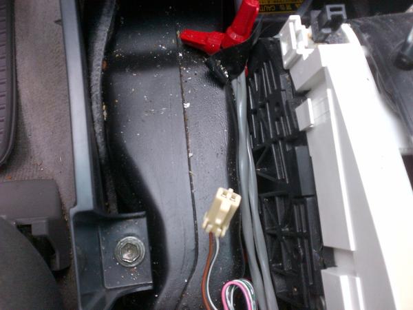 Under the center console trim. More crud and ashes.