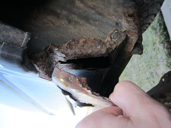 under the passenger side bumper
