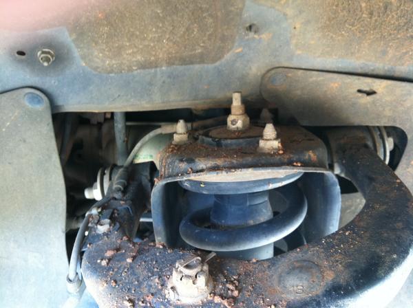 Upper strut mounts were simple, but the coilovers had allen bolts that dropped in vs. studs that stick up. Aligning the holes and putting the bolts in