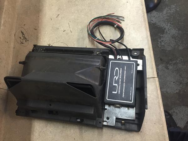 URD box behind the glove box panel. 2nd gens don't have much room to hide it