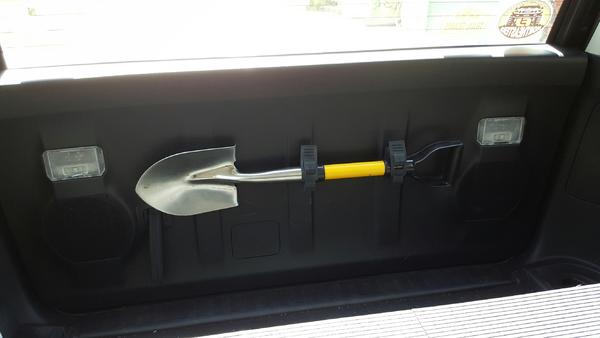 Used QuickFist mounts on the rear hatch to hold a small shovel.