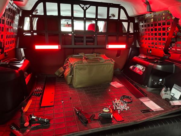 Victory 4X4 Molle panel/pet divider. 

*LED lights are rechargeable under cabinet motion lights from Amazon.