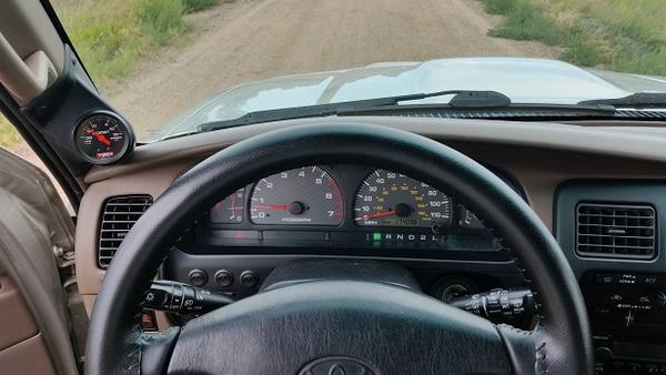 view of dash and boost gauge