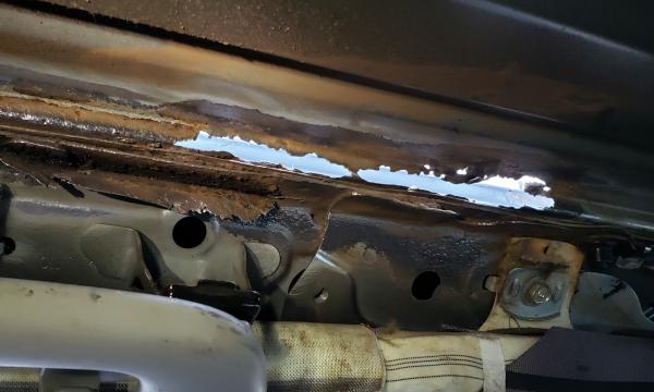 Water damage from improper roof rack installation—my fault. Front driver-side inside