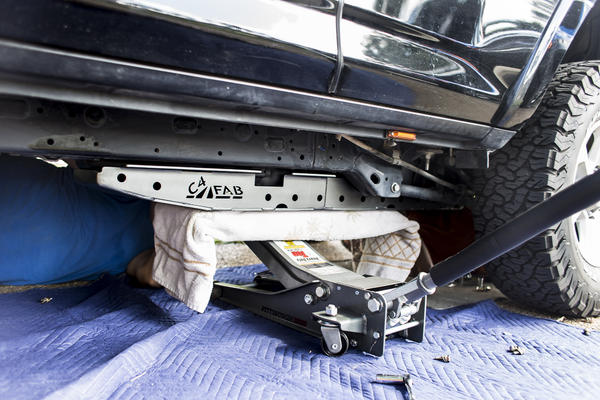 We used a jack to help us raise the C4 Fab Fuel Tank skid and position it where we needed it