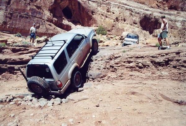 Winching up Pritchett Canyon's Rockpile obstacle. This is near Moab.