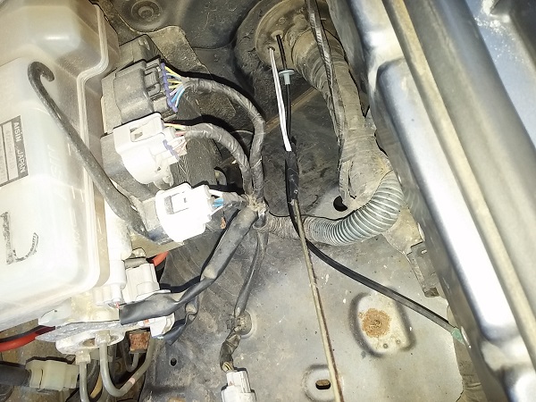 Wire pulled through firewall.