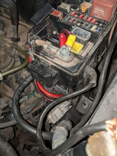 Wiring for the aux box and amp run through the firewall and the bottom of the fuse box - looks nice and clean when the box is put together.