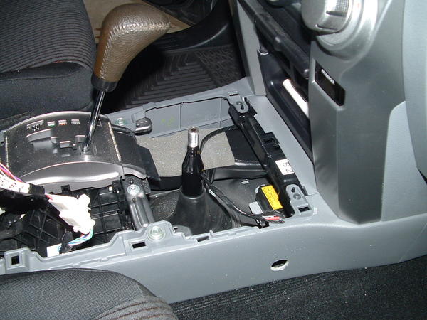 Wiring in console. Hole drilled in console side for installation of the socket.
