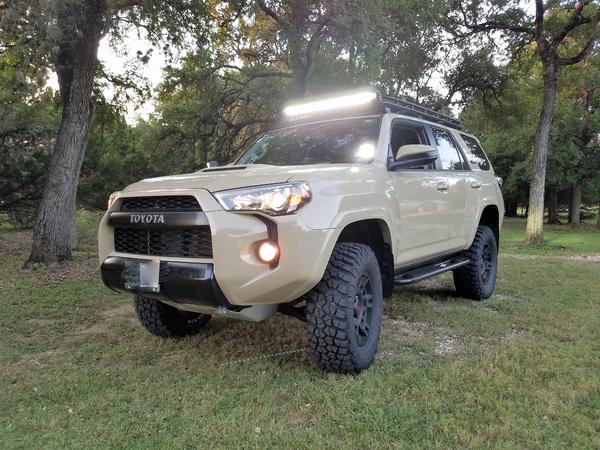 With new BFG 285/70/R17's and Rigid Radiance Light bar mounted to Gobi rack.  It also shows the 2.5 inch lift with OME BP-51s all around.