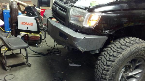 WORKING ON MODIFING FRONT TJM BUMPER OFF MY 93 RUNNER
