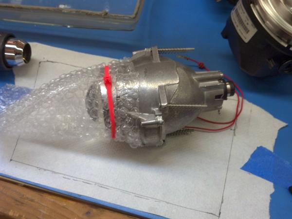 You can Ziptie and tape the bubble wrap over the lense to protect it while you assemble the headlight, also you can stick the bulbs in to keep dust pa