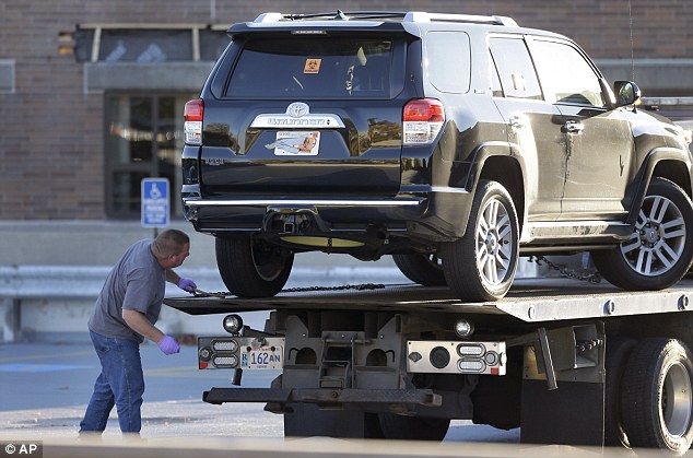 1413159510378_wps_49_A_tow_truck_driver_prepar.jpg