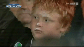 Kid-Rubs-Ice-Cream-on-Face.gif